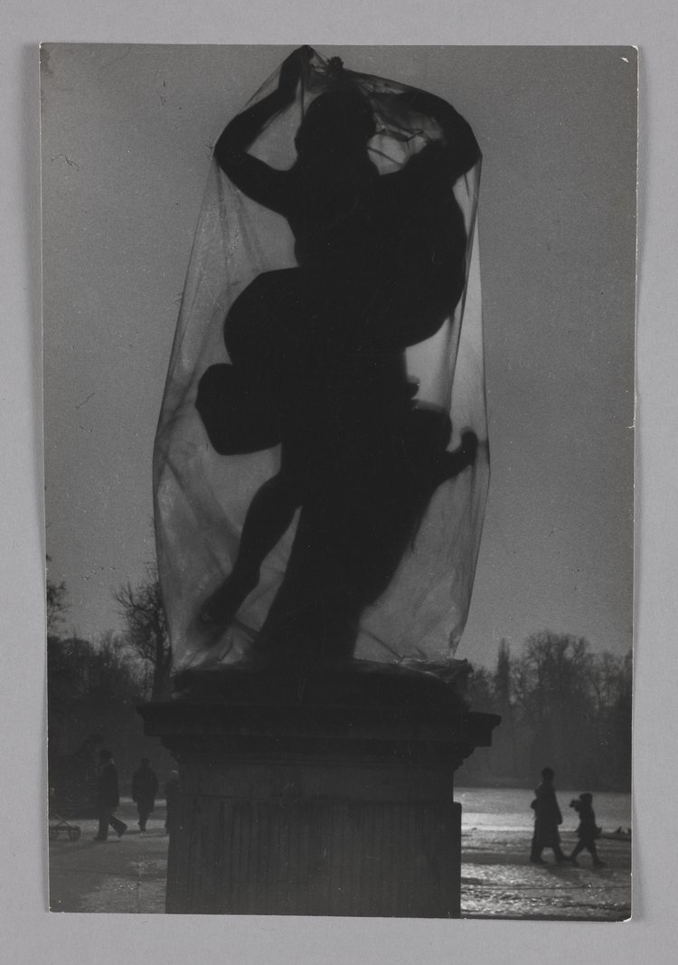 Statue of Maenad wrapped in plastic in Royal Baths Park