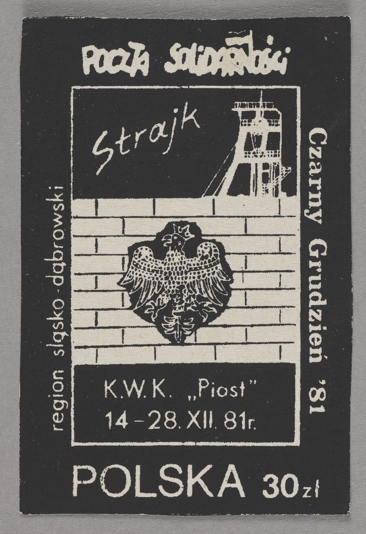 Znaczek okolicznościowy z wizerunkiem muru z dziurą z orłem śląskim w koronie oraz szybu górniczego