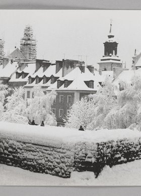 View of the roofs of burgher houses in Mostowa St. and the roof of St. Hyacinth’s Church in winter