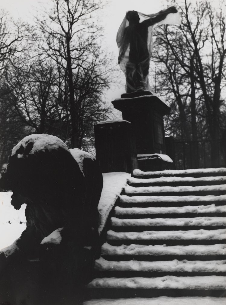 Statue of the Gladiator wrapped in plastic in Royal Baths Park
