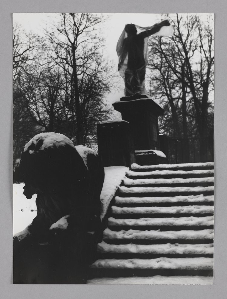 Statue of the Gladiator wrapped in plastic in Royal Baths Park