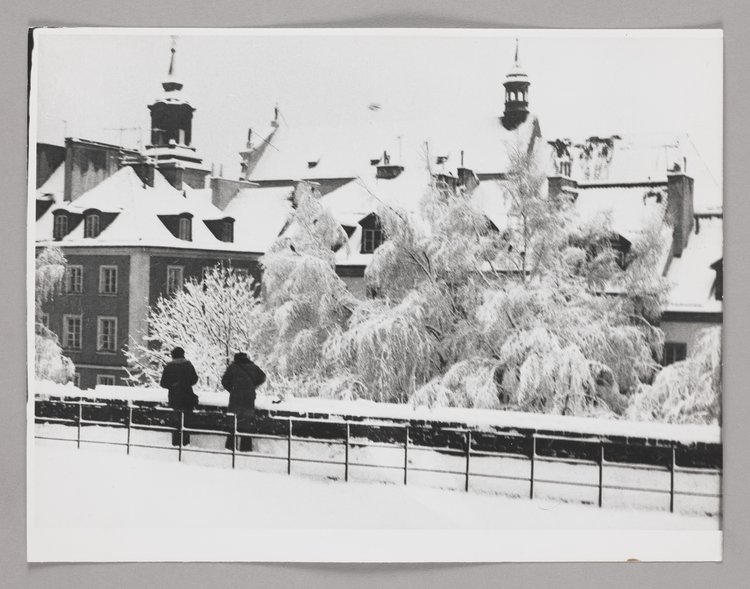 View of the roofs of burgher houses in Mostowa St. and the roof of St. Hyacinth’s Church in winter