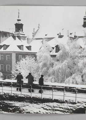 View of the roofs of burgher houses in Mostowa St. and the roof of St. Hyacinth’s Church in winter
