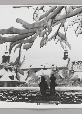 View of the roofs of burgher houses in Mostowa St. and the roof of St. Hyacinth’s Church in winter