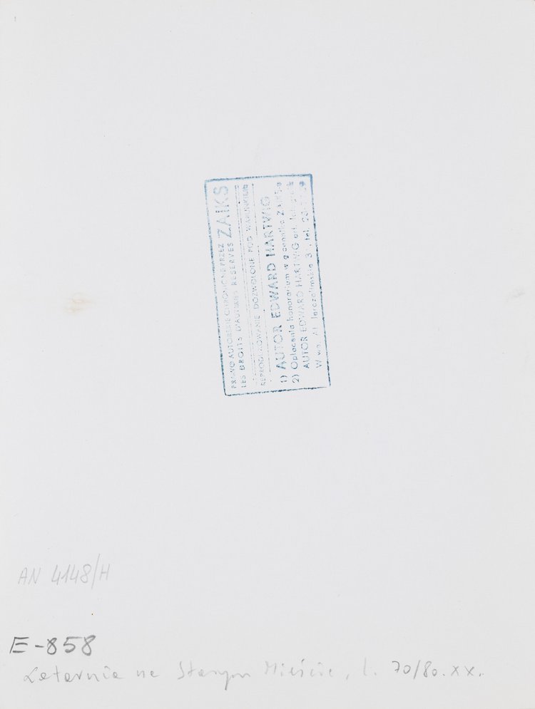 Changing the light bulb of a street lamp in Old Town Market Square